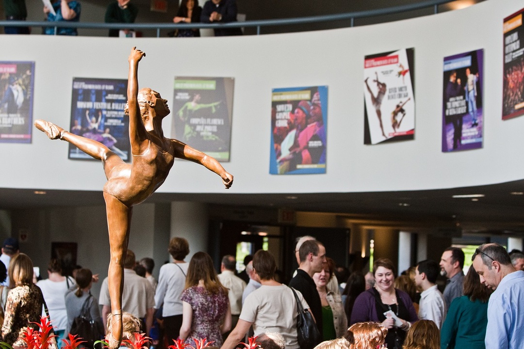 Attitude,  a sculpture by Doris Catullo rises above a group in the Lobby of  the Center for the Arts Concert Hall.