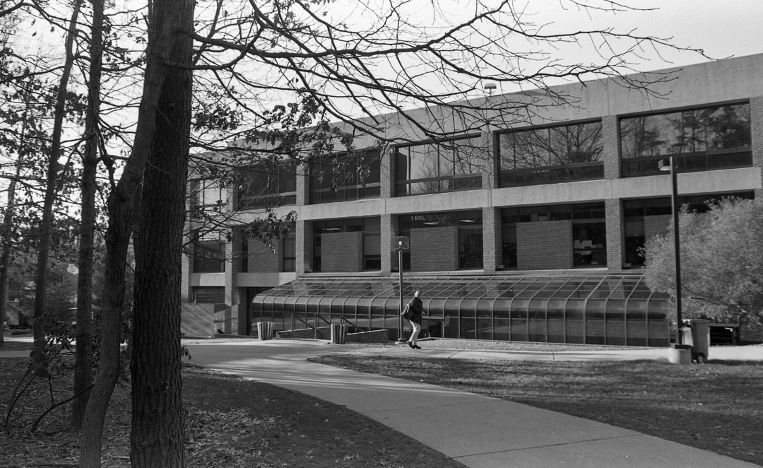 Student walks by the south-facing side of Student Union Building I