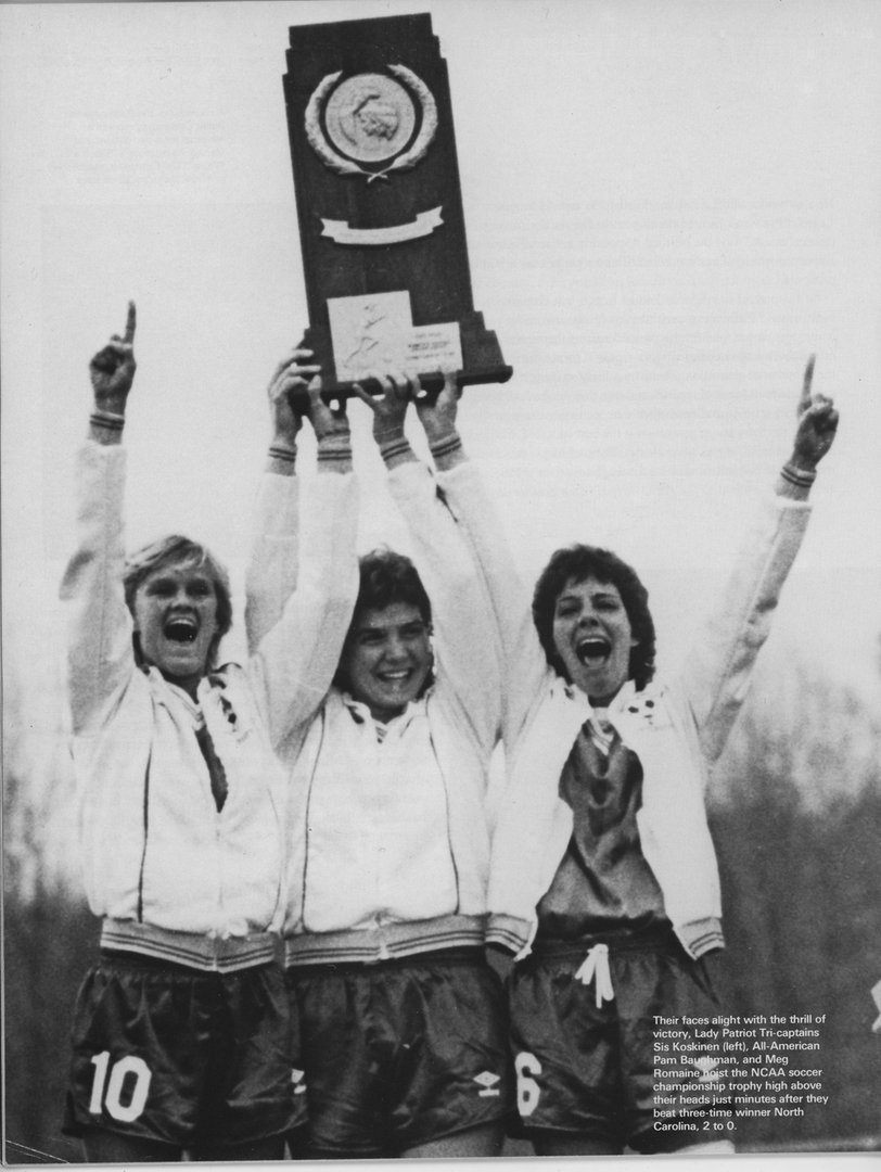 1985 George Mason University Women's Soccer members team raise the NCAA Championship trophy