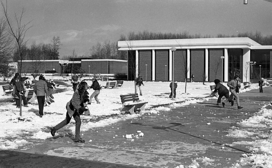 Snowball fight with Fenwick Library and Lecture Hall in background