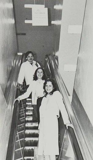 Law students ride the escalator in Arlington's Original building