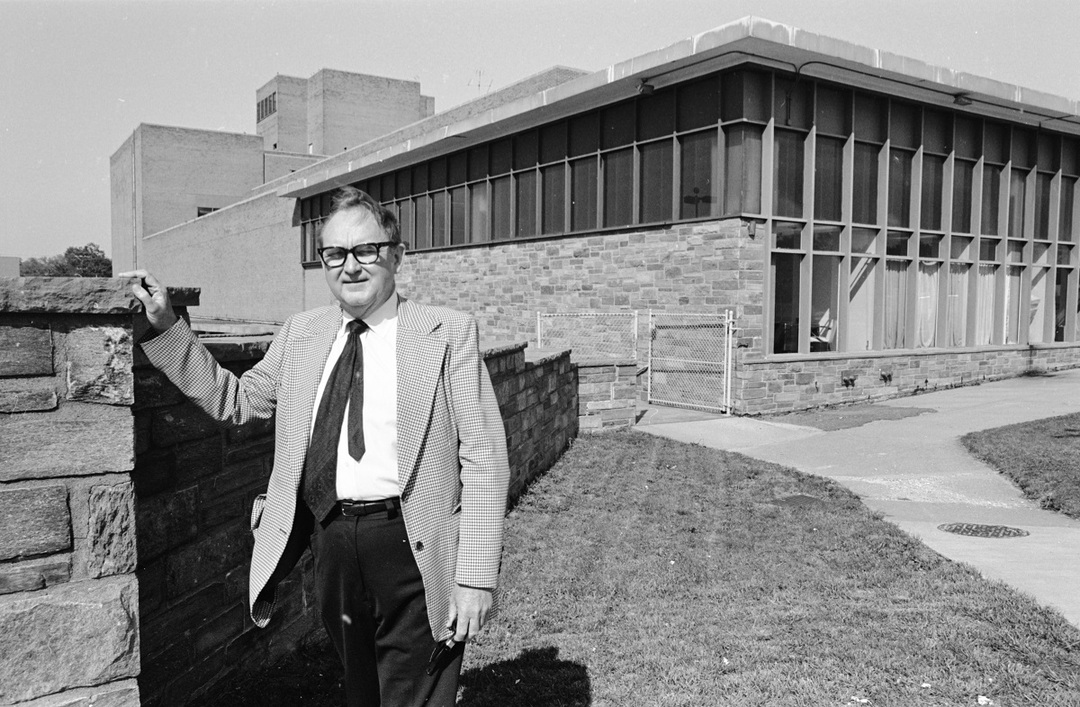 George Mason University School of Law Dean, Ralph N. Norvell, in front of the School of Law building