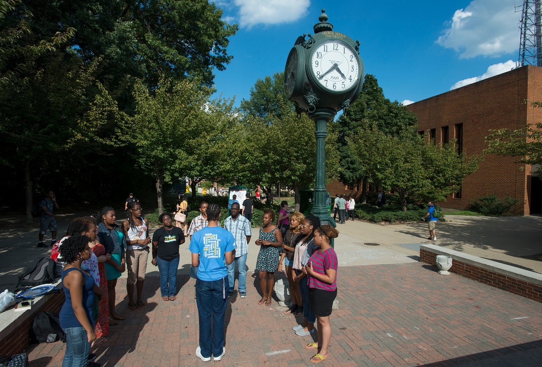 Students gather near the Clock